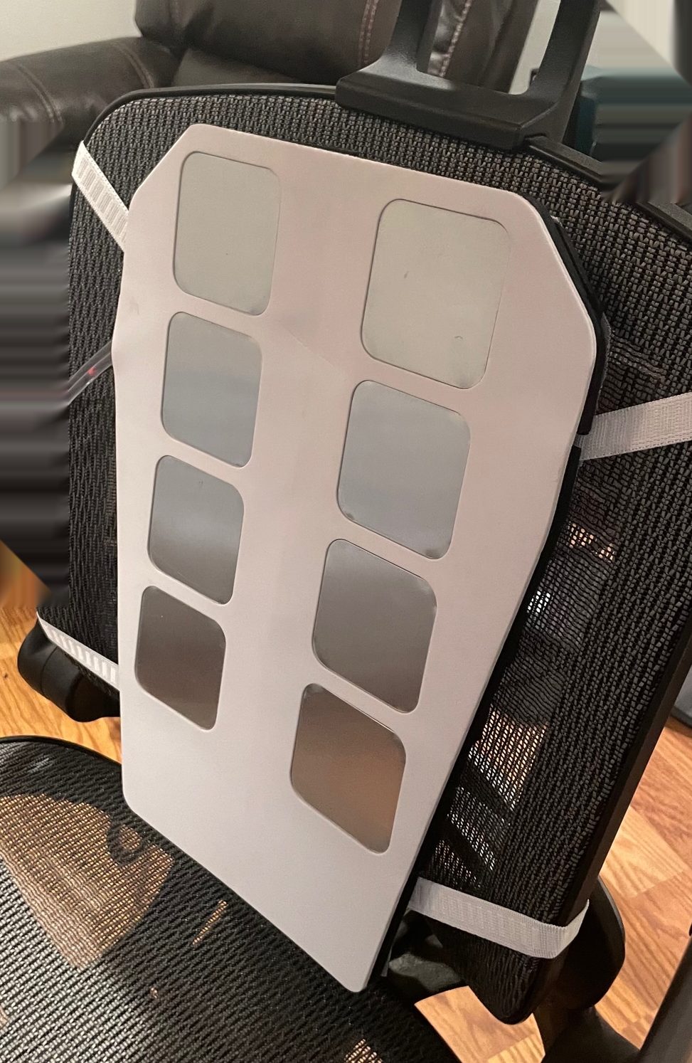 Prototype panel wrapped in a blue vehicle-seat membrane